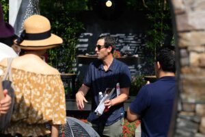 Landscape designer reviewing construction documents during Mandala Moon Gate Garden installation in Nagasaki, Japan