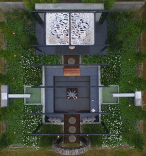 Aerial view of geometric garden with circular moon gate, fire sculpture and symmetrical plantings at Nagasaki Japan