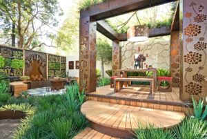 Prefabricated outdoor pavilion with decorative corten steel panels and timber decking at Melbourne International Flower Show