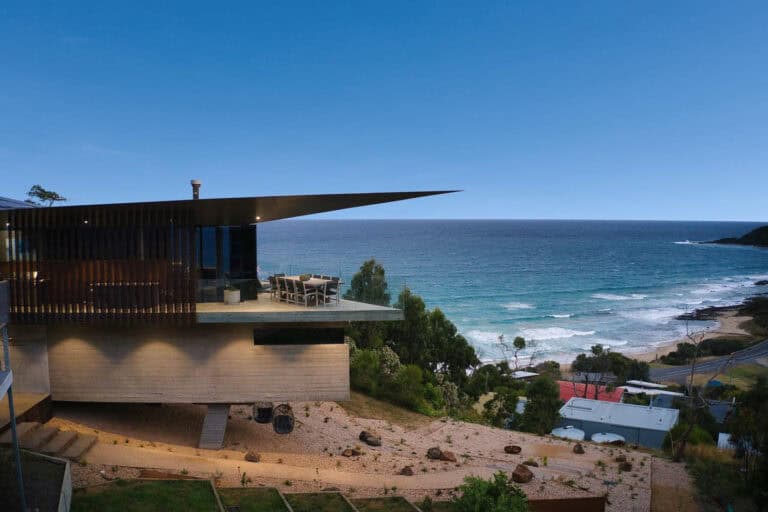 Modern coastal home at Separation Creek with dramatic cantilevered roofline overlooking the Southern Ocean and surrounding bushland.