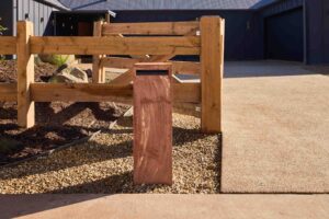 Natural timber post and rail fencing with gravel landscaping at The Block Daylesford House 5 modern entertainer garden