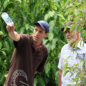 Two men discussing landscape design during construction of The Wave Garden at Melbourne International Flower & Garden Show