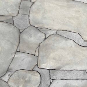 Irregular natural stone pavers with curved joints creating organic pathways in Mount Buninyong country estate garden